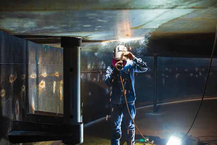 Worker wearing welder PPE