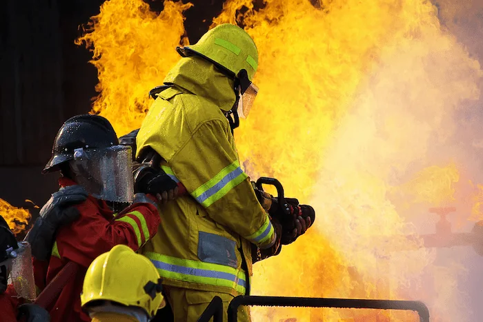 firefighter wearing fire-resistant clothing