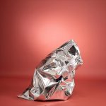 Aluminised poncho packed in action